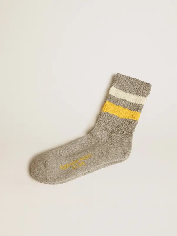 Gray socks with distressed details and yellow and white stripes online