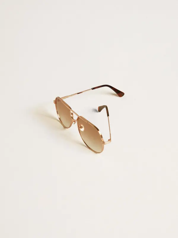 Aviator style sunglasses with rose-gold frame and honey-colored lenses online