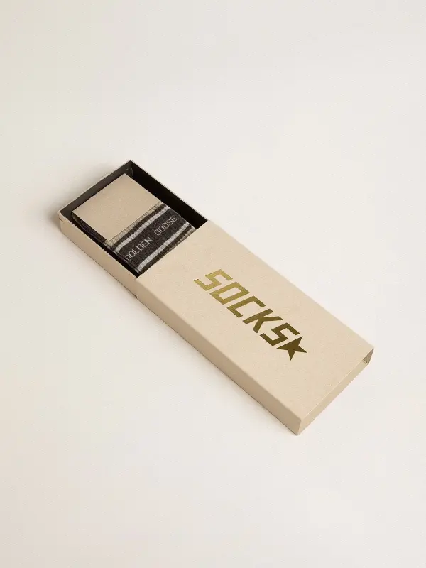 Dark grey socks with distressed details and cream and worn-white stripes online