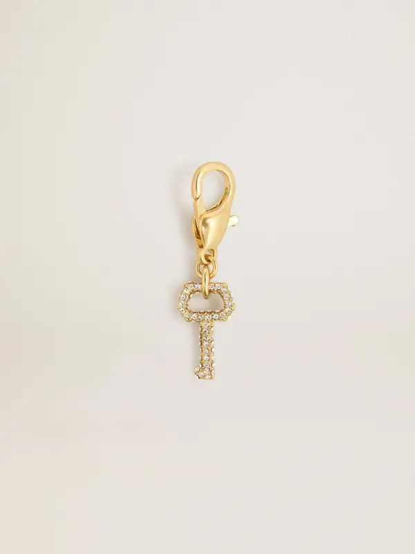 Key-shaped charm in gold-colored brass with crystals online