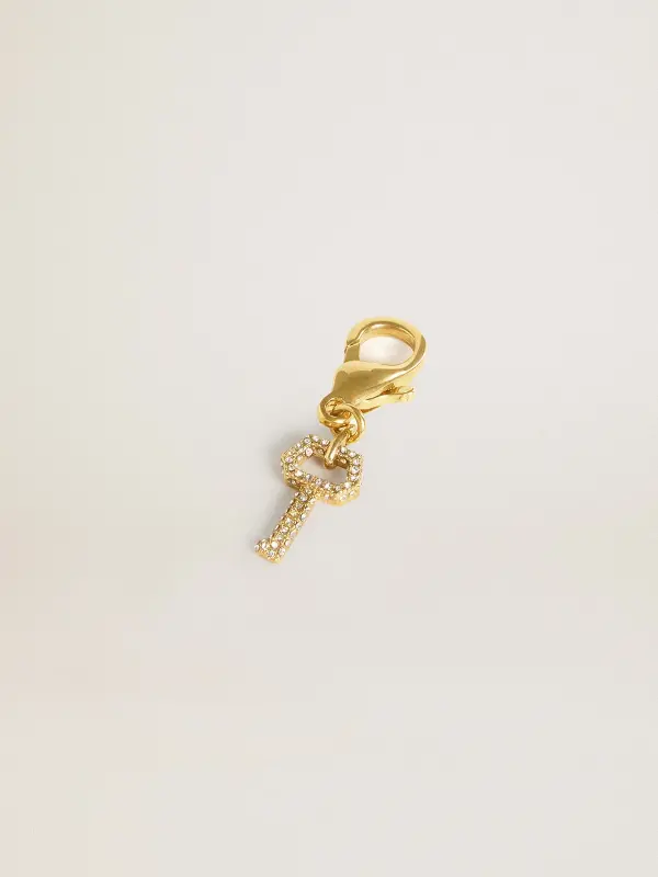 Key-shaped charm in gold-colored brass with crystals online