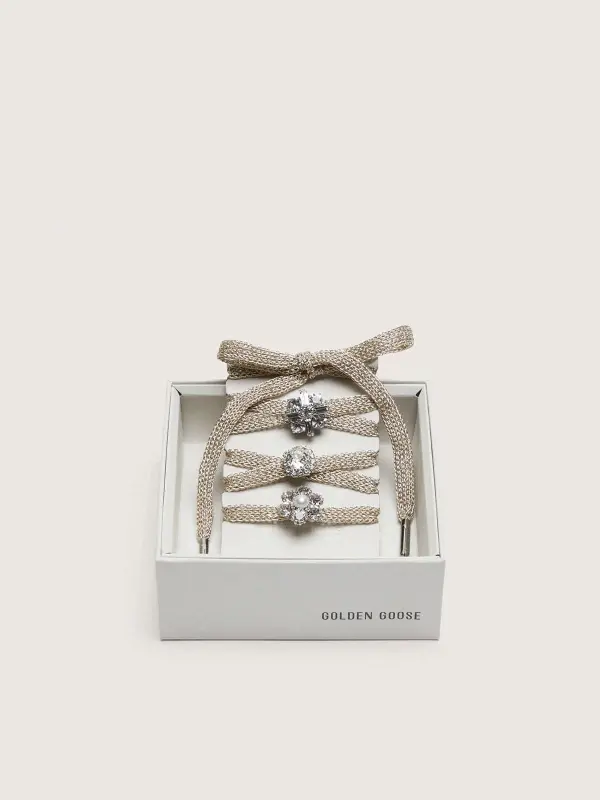 Skins "Sparkling" braided gold-colored laces with shimmering charms online