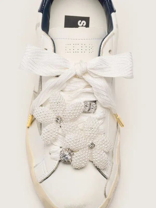 Skins "Sparkling" cream striped laces with beaded charms and crystal charms online