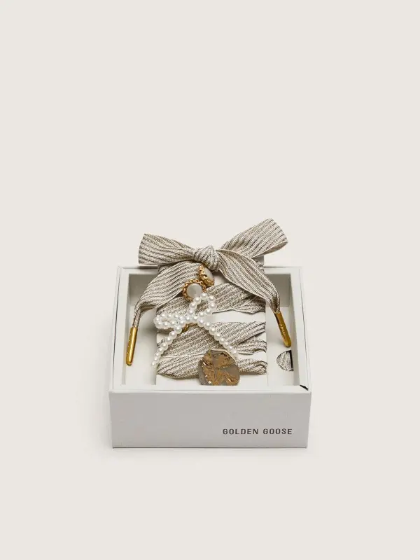 Skins "Sparkling" white and gold striped laces embellished with charms online