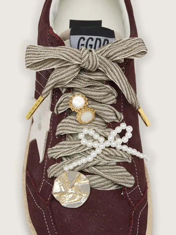 Skins "Sparkling" white and gold striped laces embellished with charms online