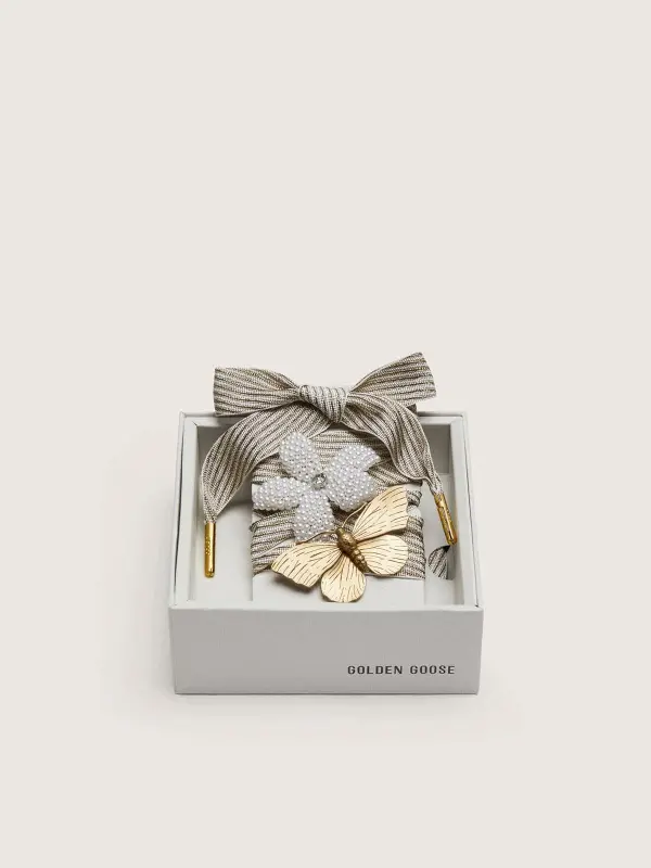 Skins "Vintage" white and beige striped laces embellished with two charms online