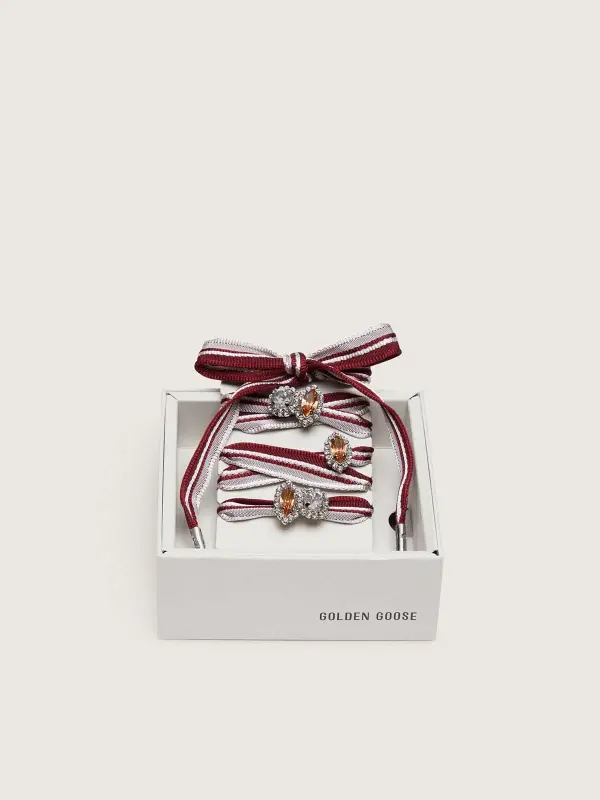 Skins "Vintage" white and burgundy striped laces embellished with charms online