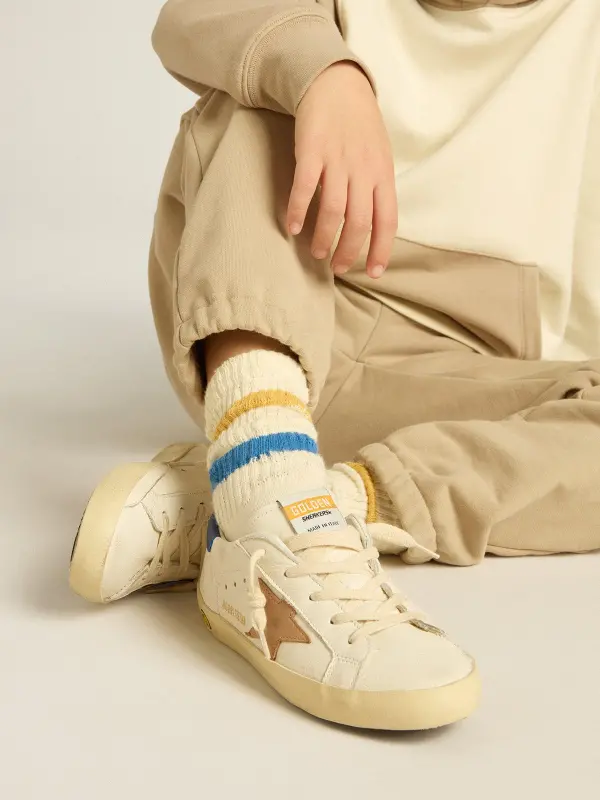 Worn white Kids socks with distressed details and two-tone bright blue and mustard stripes online