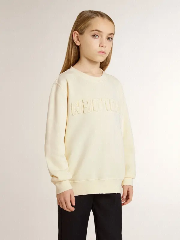 Girl’s cream-colored sweatshirt with patch writing online