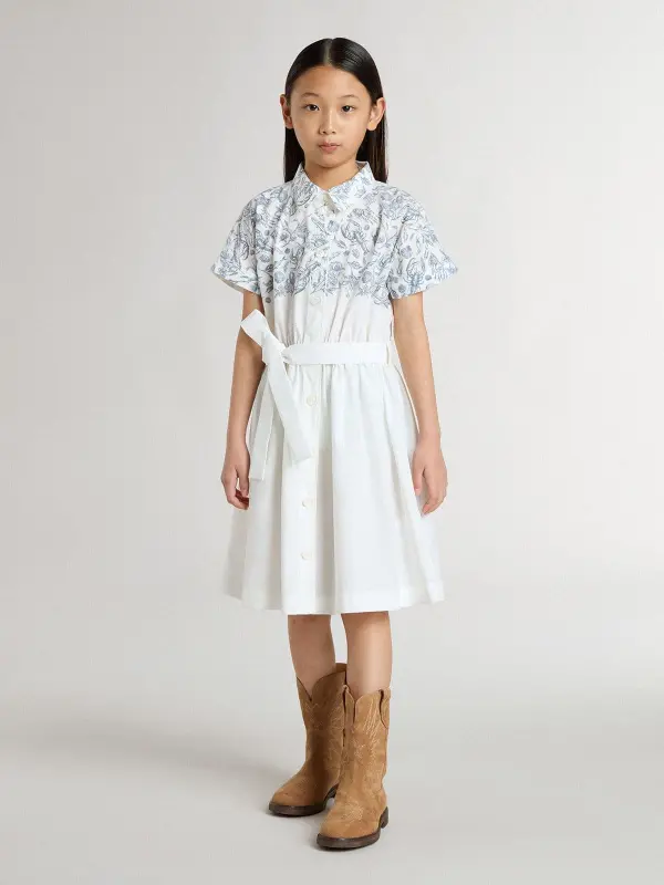 Girl’s shirt dress in white cotton canvas with a blue nautical print and white piping online